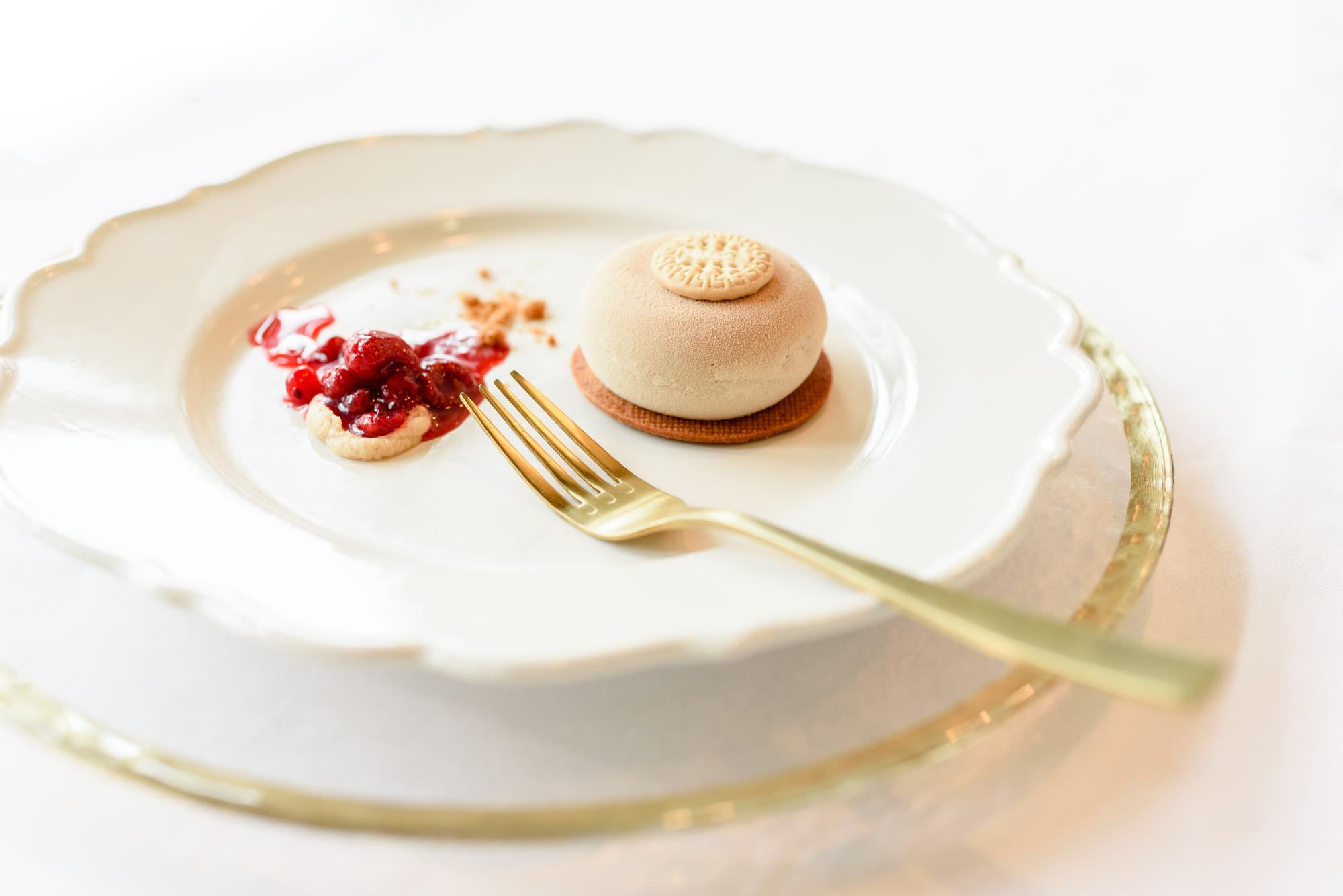Plated tasting menu with gold accents